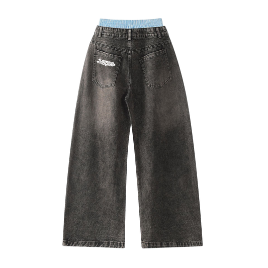 Black jeans with a brand logo on the back pocket against a white background